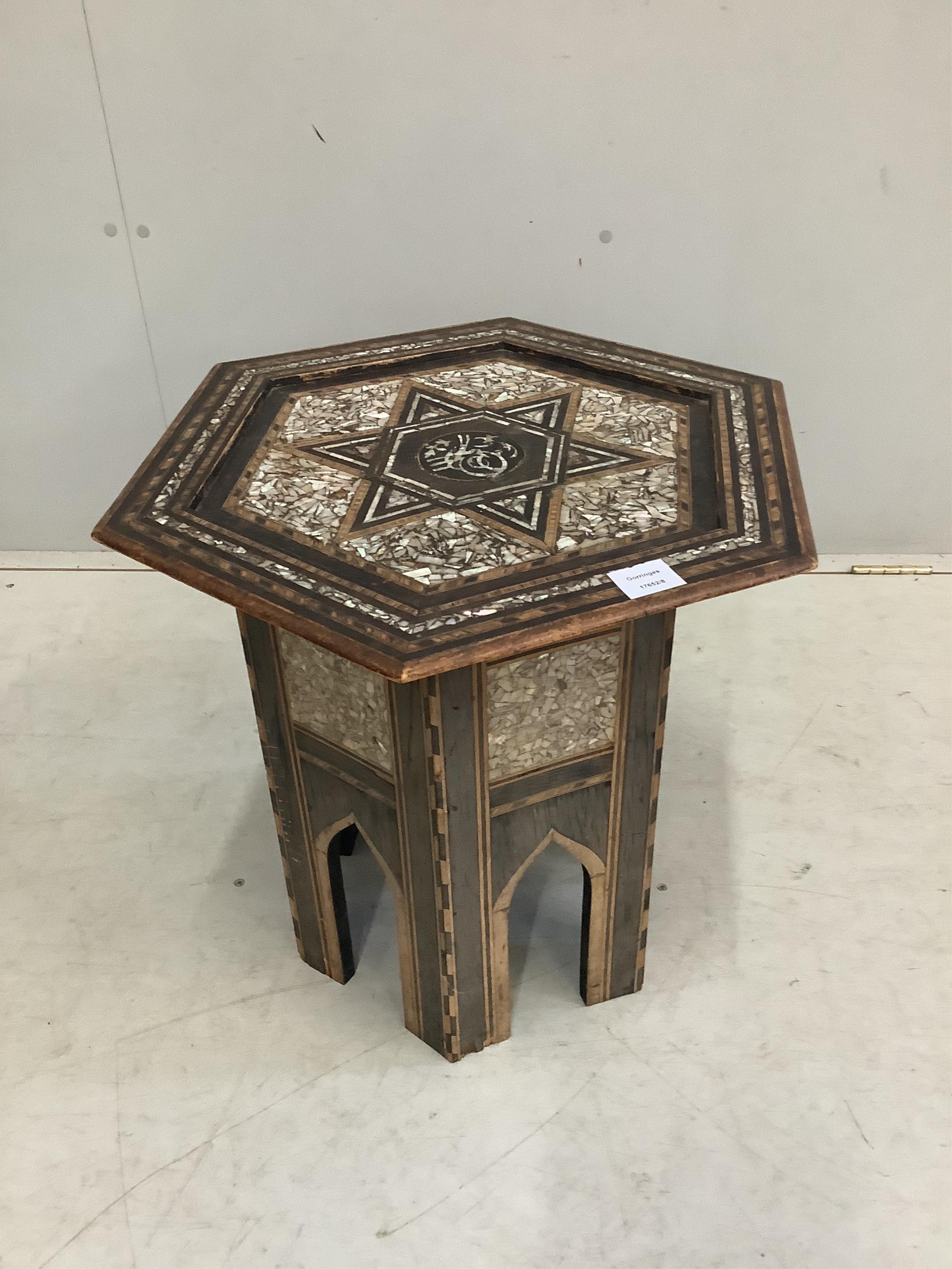 A Turkish Ottoman hexagonal mother of pearl inlaid table, width 49cm, height 51cm. Condition - fair